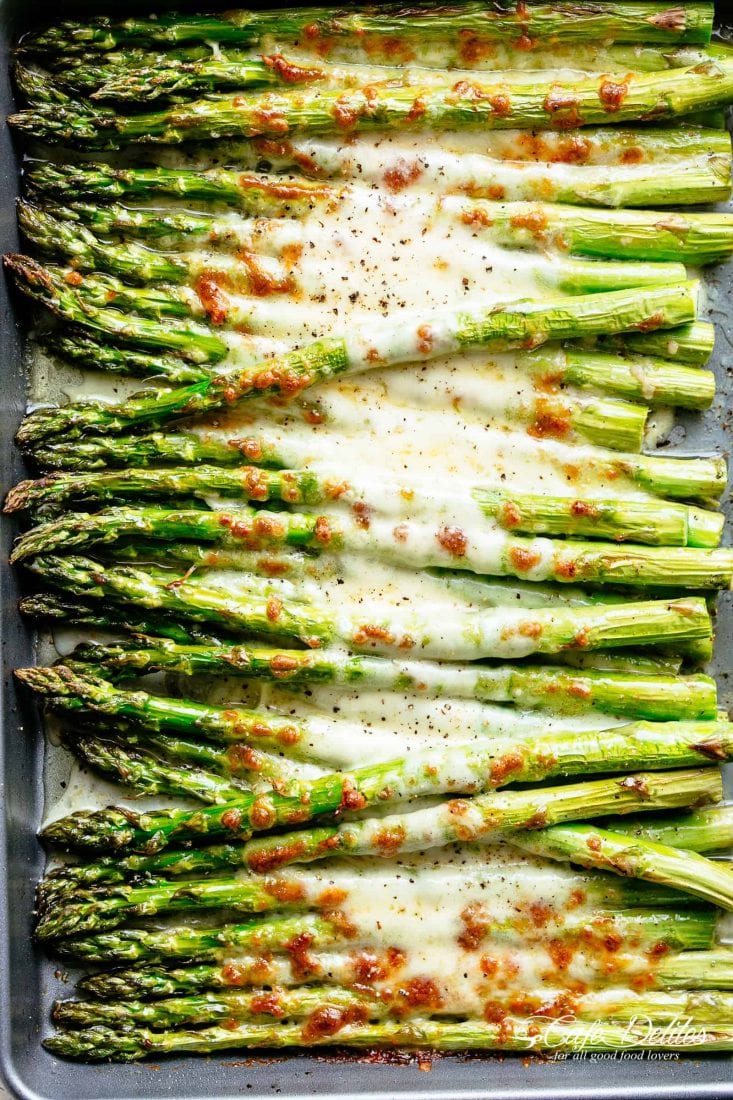 Cheesy garlic asparagus on baking pan