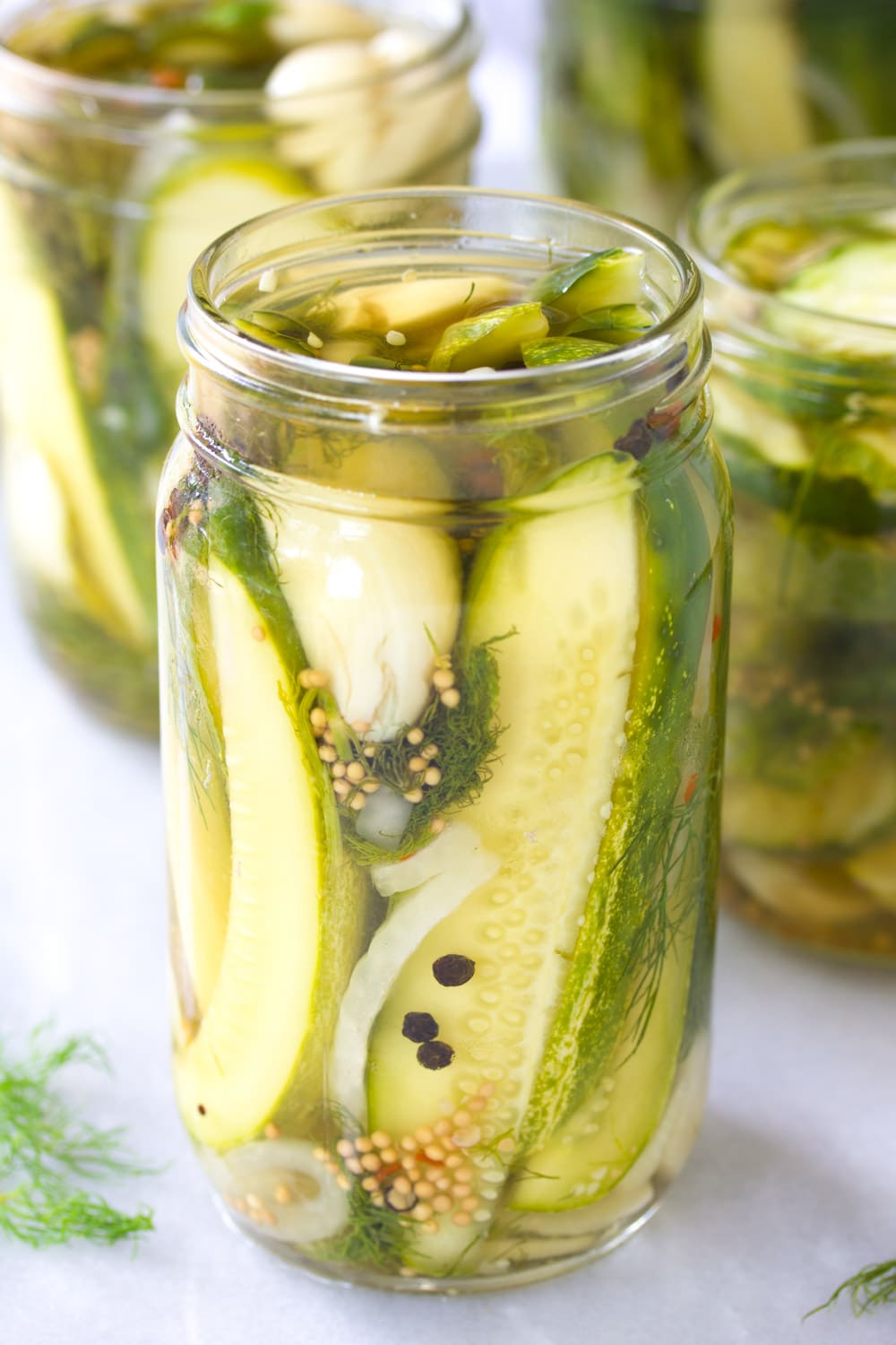 Jar of pickles on white countertop
