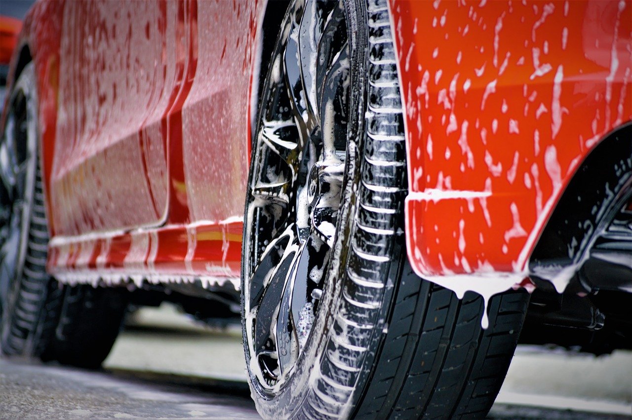 Close up of wet red car for car wash fundraising idea