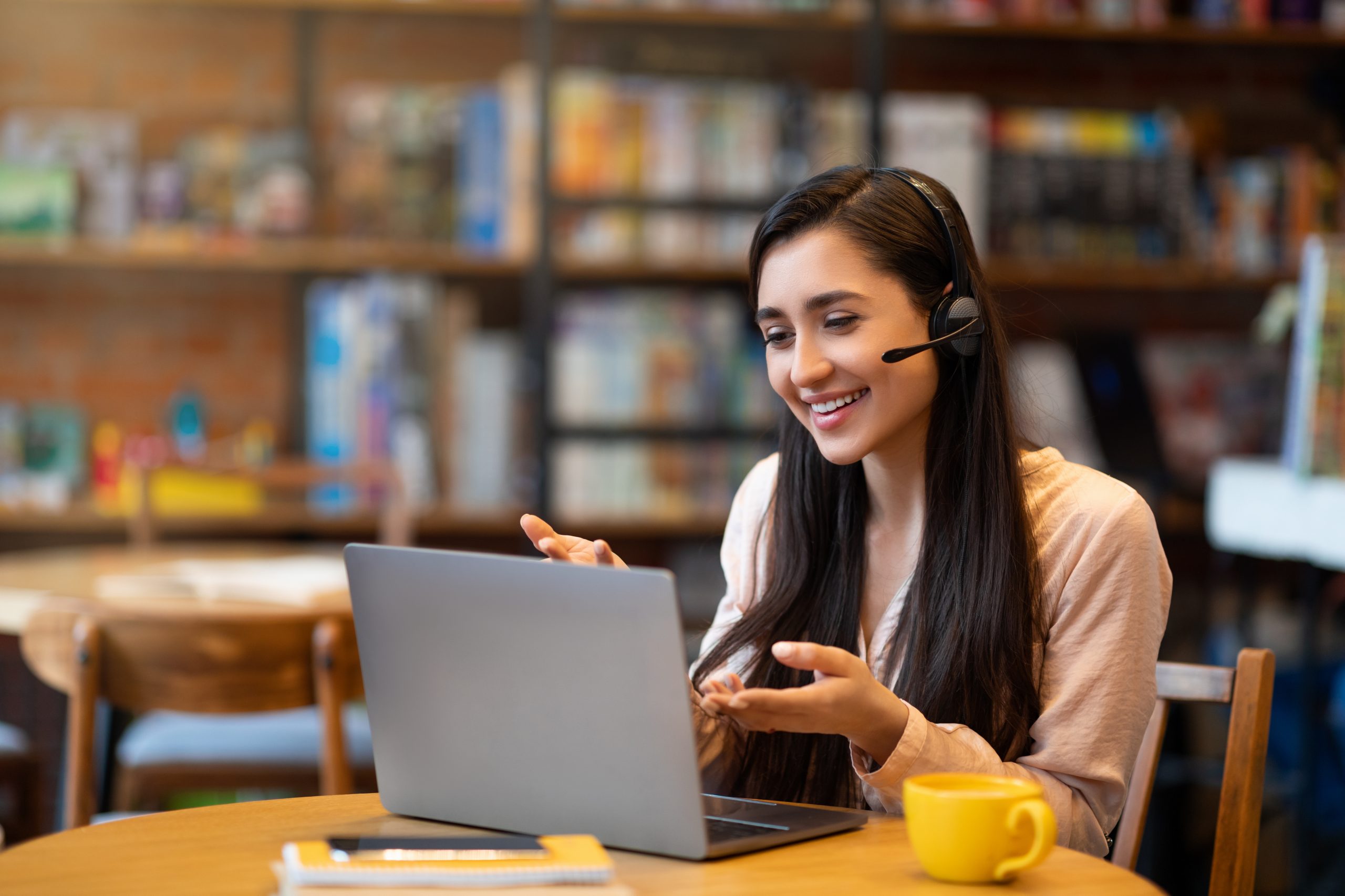 Female tutor teaching via video conference