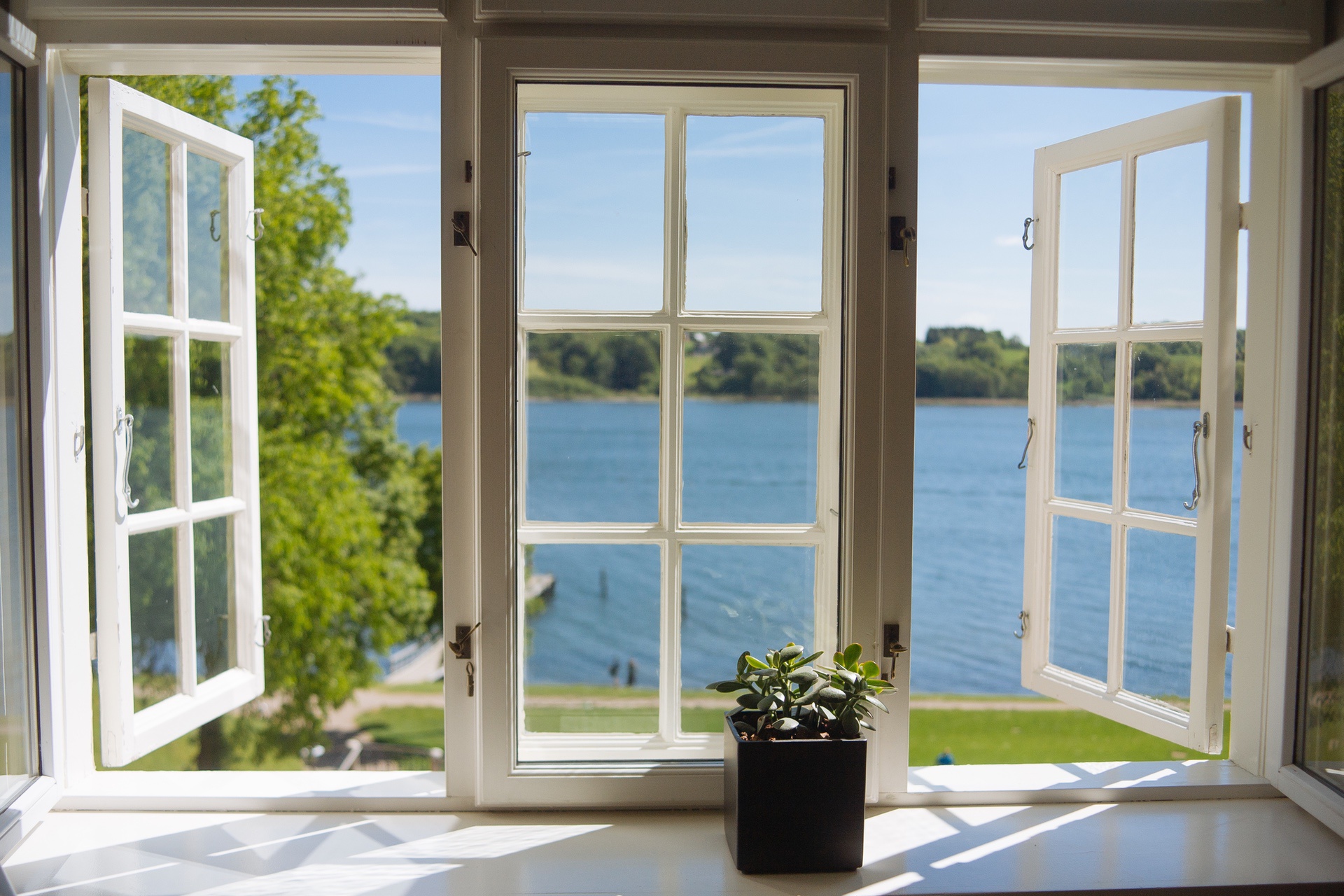 Open windows overlooking a lake