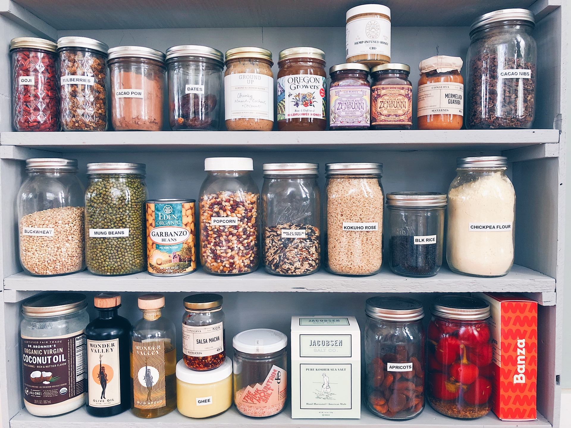 Shelves with jars of pantry staple items